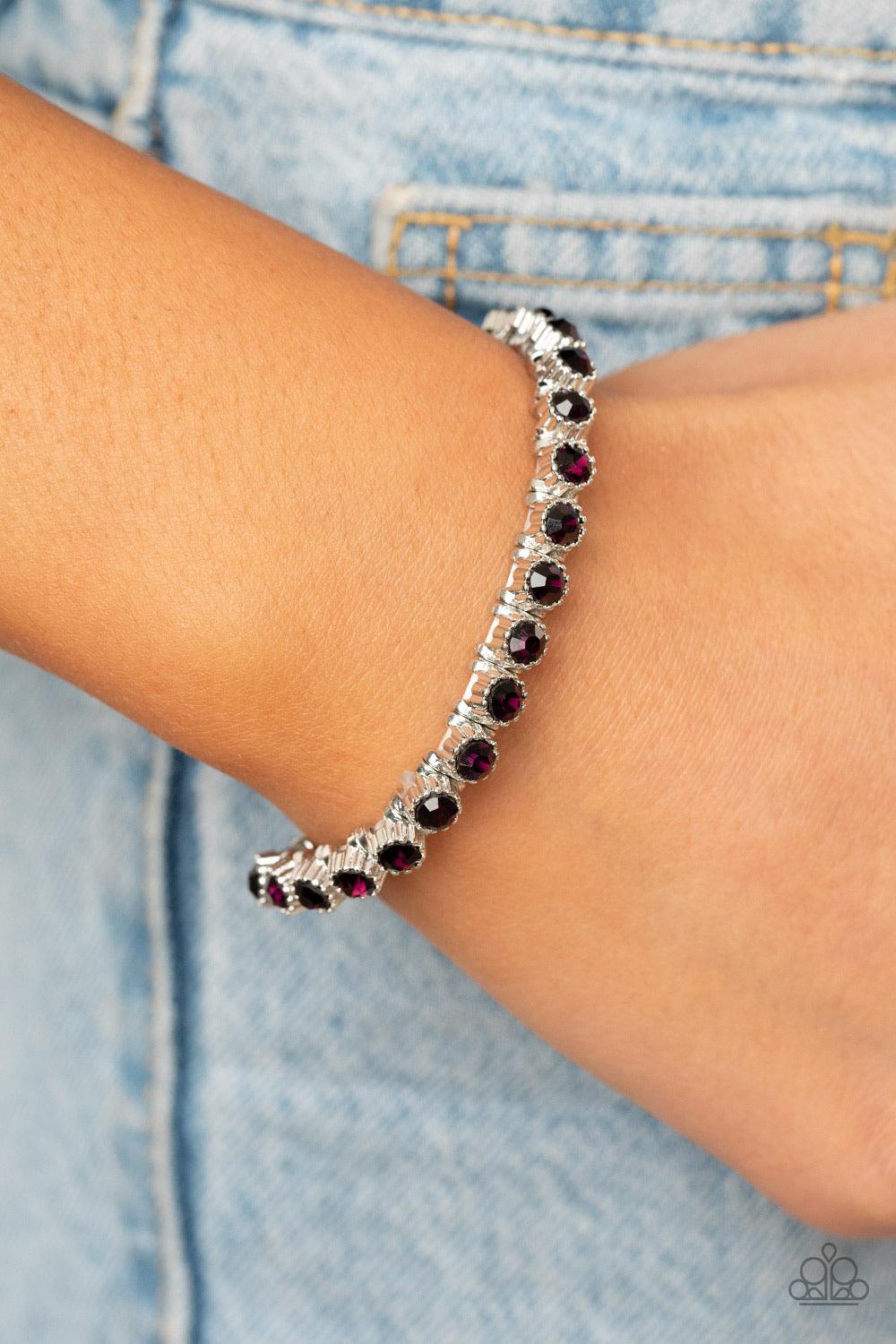 Paparazzi Accessories Starry Social - Purple Featuring shiny silver studded fittings, glittery purple rhinestones glide along stretchy bands around the wrist, creating a glamorous statement piece. Sold as one individual bracelet. Jewelry