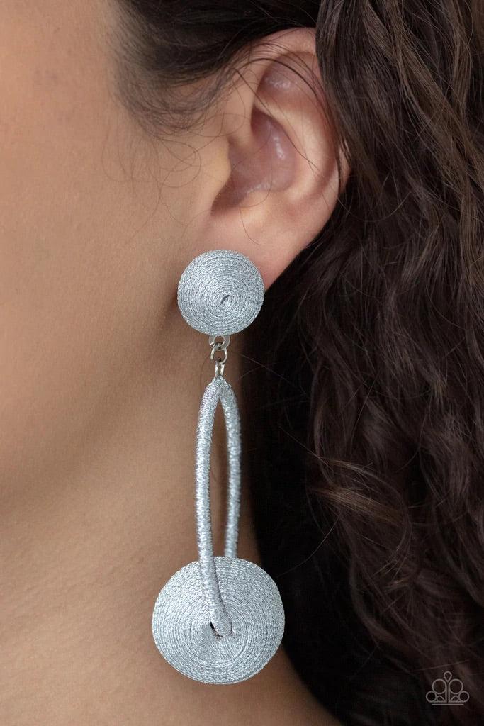 Paparazzi Accessories Social Sphere - Silver Shimmery silver thread wraps around an oversized bead that is fitted in place along the bottom of a matching threaded hoop. The glistening display links to the bottom of a matching silver threaded fitting, crea