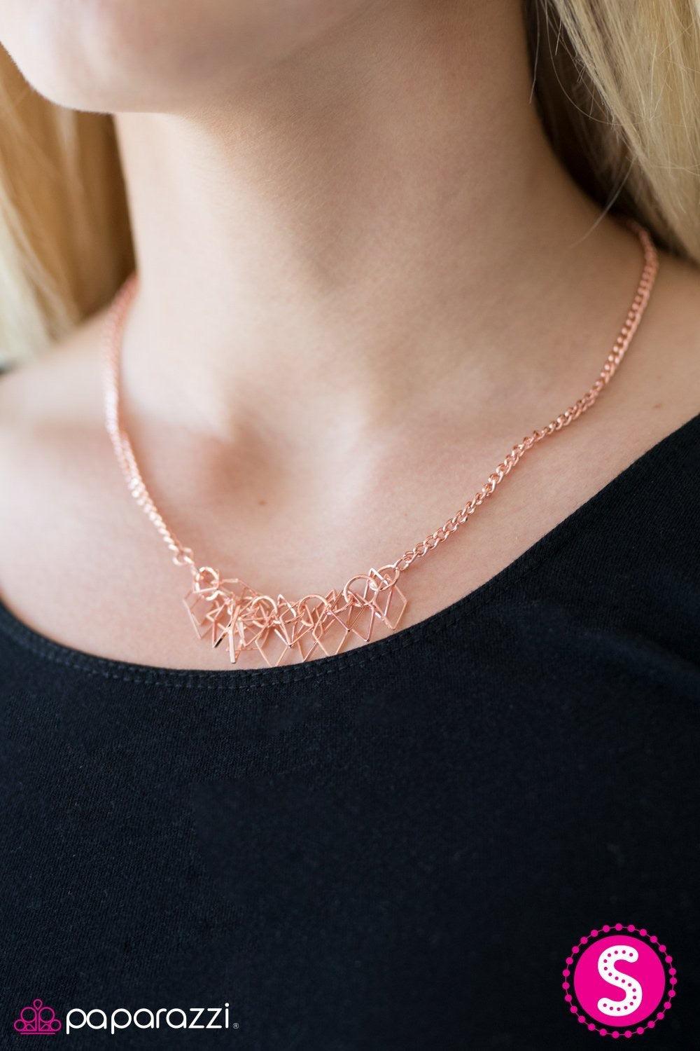 Paparazzi Accessories Beast Mode - Copper A thick copper chain gives way to a clustered fringe below the collar. Featuring a shiny copper finish, dainty diamond-shaped silhouettes swing from the bottom of the chain, creating a fierce fringe. Features an a