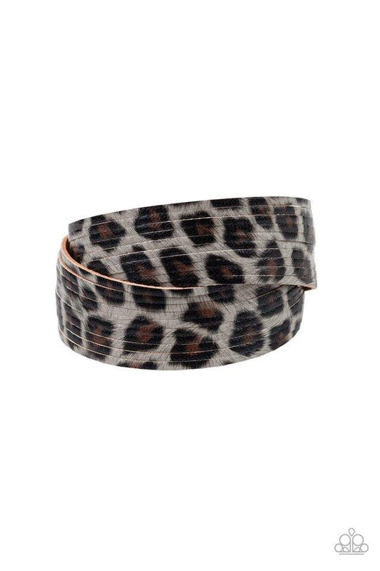 Paparazzi Accessories Hey GRRRirl - Silver Painted in a lifelike gray, brown, and black cheetah print, thick leather bands have been spliced into layers that wave across the wrist for a wild look. Features an adjustable snap closure. Sold as one individua