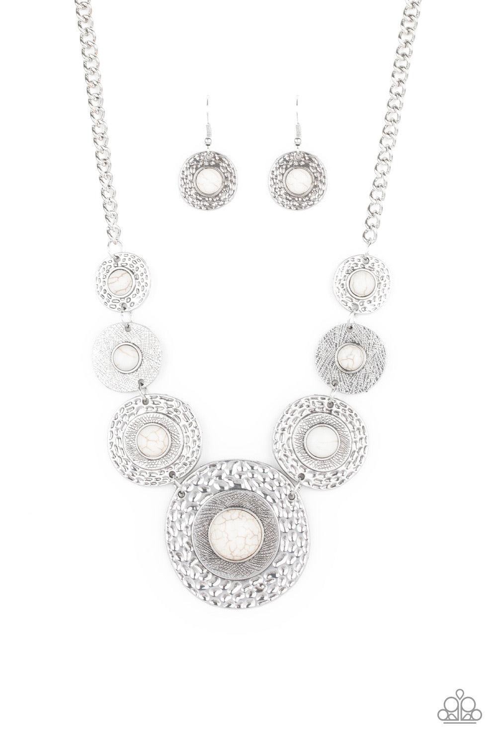 Paparazzi Accessories Tiger Trap - White Dotted with smooth white stone centers, mismatched hammered silver frames gradually increase in size as they link below the collar for a fierce look. Features an adjustable clasp closure. Jewelry