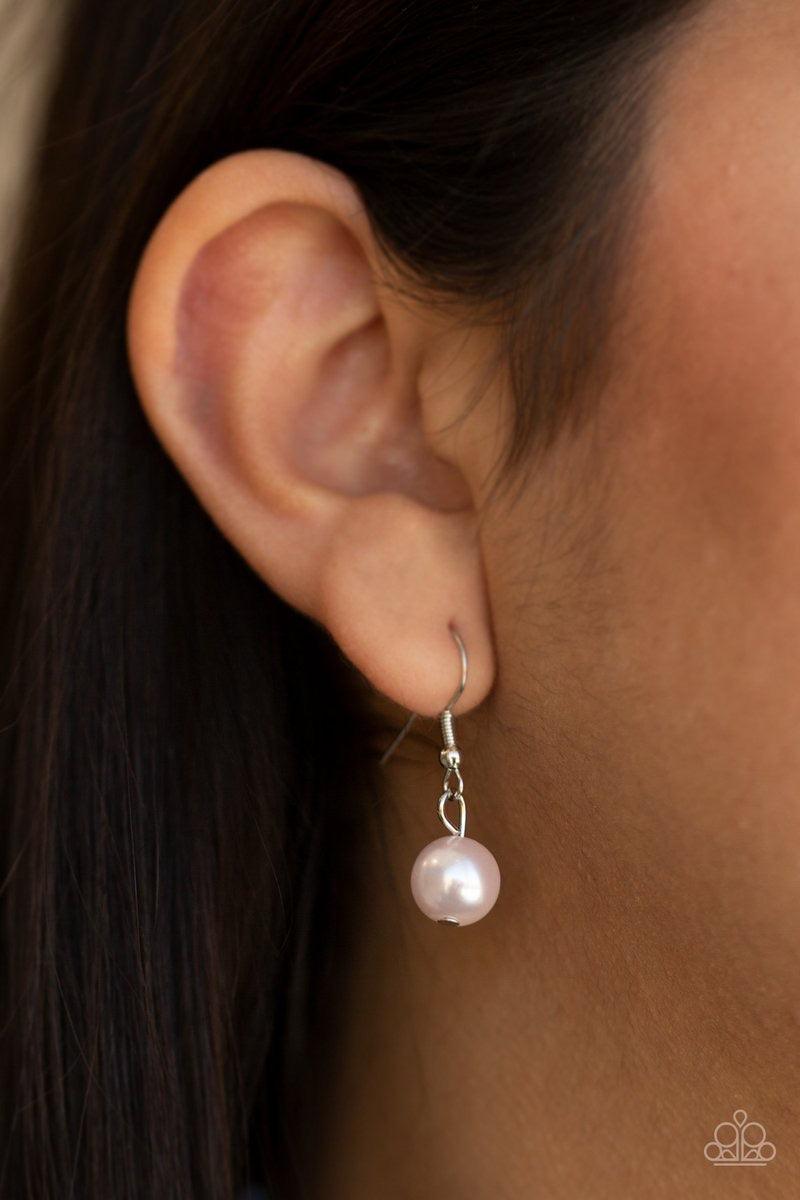 Paparazzi Accessories Uptown Heiress ~Pink Infused with dainty silvery rhinestone encrusted beads, a refined collection of over sized pink pearls are threaded along an invisible wire below the collar for timeless dazzle. Features an adjustable clasp closu