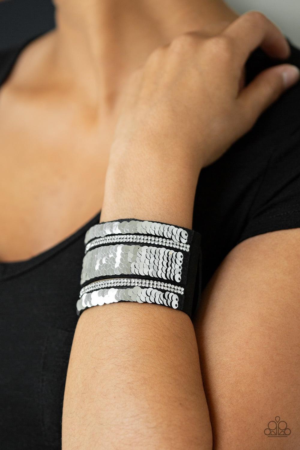 Paparazzi Accessories MERMAID Service - Blue Infused with strands of blinding white rhinestones, row after row of shimmery sequins are stitched across the front of a spliced black suede band. Bracelet features reversible sequins that change from silver to