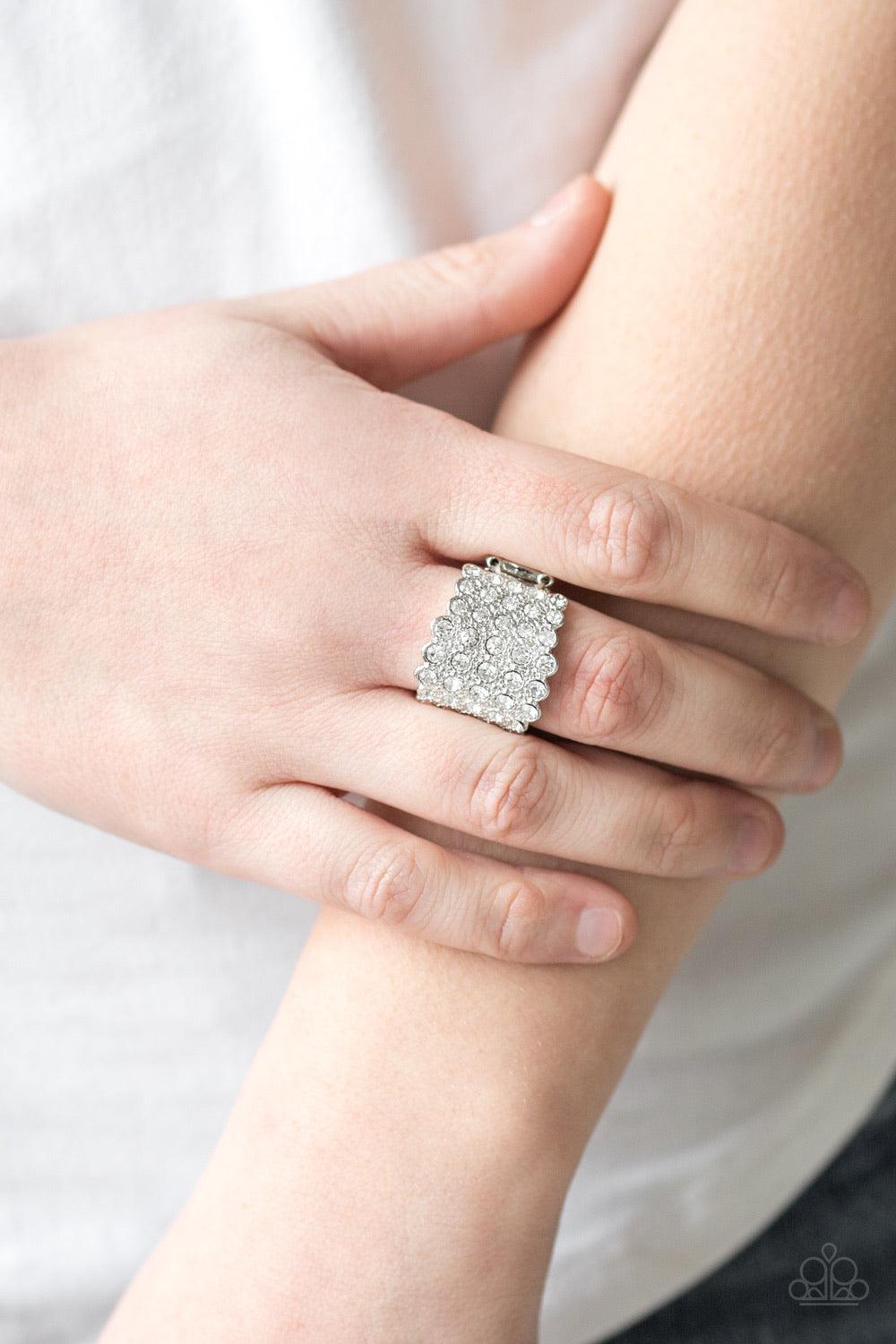 Paparazzi Accessories Million Dollar Masquerade ~White Row after row of blinding white rhinestones are stacked across a thick silver band for a dramatic look. Features a stretchy band for a flexible fit.
