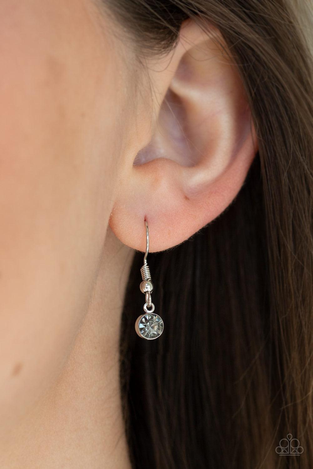 Paparazzi Accessories Enchanted Meadow - Silver Encrusted in smoky rhinestones and stacked with linear textures, feathery silver leaf pendants swing from the bottom of a lengthened silver chain for a seasonal flair. Features an adjustable clasp closure. J