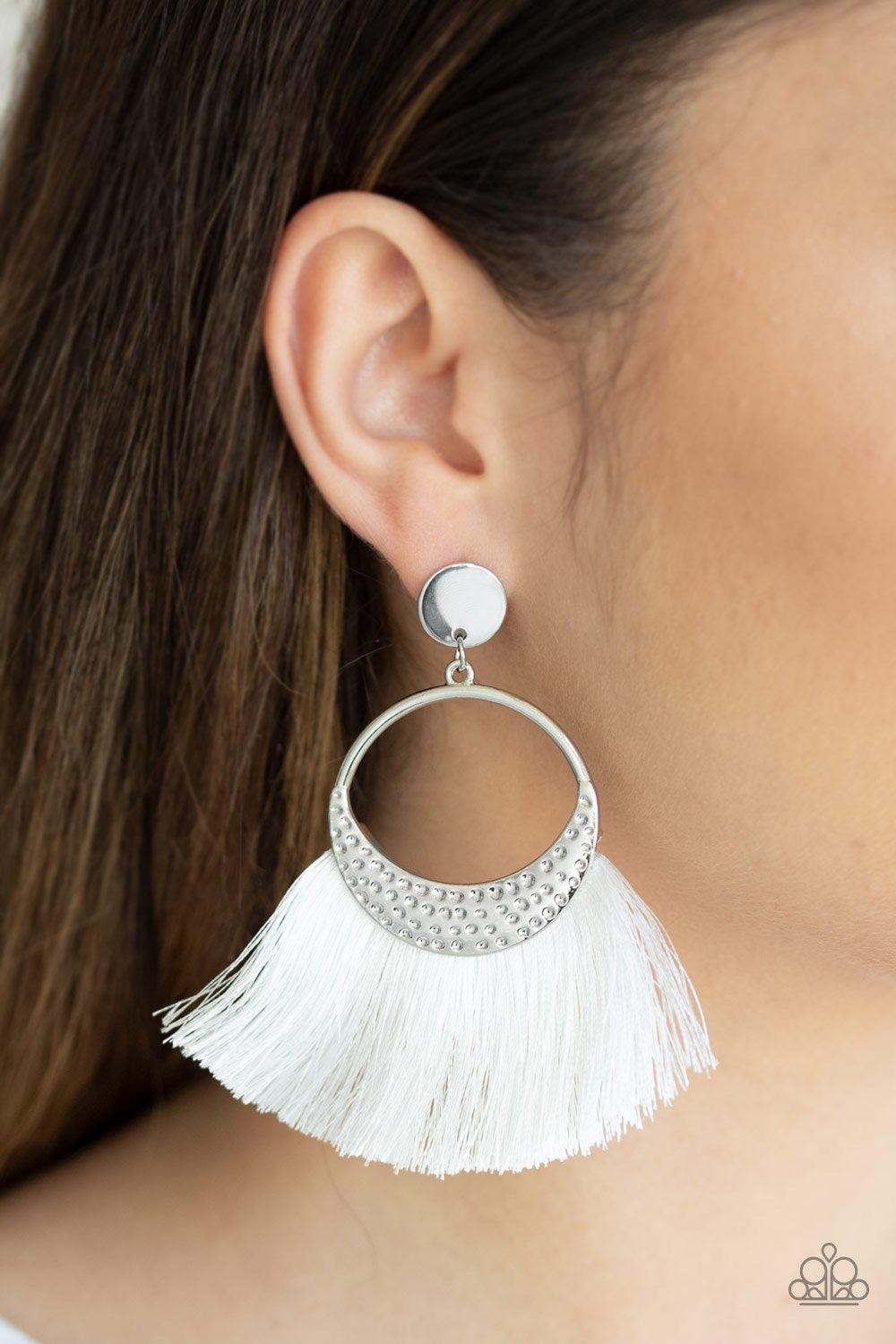 Paparazzi Accessories Spartan Spirit - White Shiny white thread flares from a hammered silver frame for a strikingly tasseled look. The spirited frame attaches to a glistening silver disc fitting for a modern twist. Earring attaches to a standard post fit