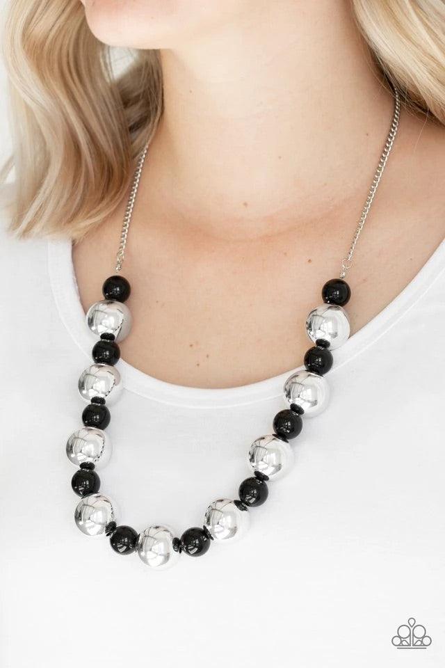 Paparazzi Accessories Top Pop - Black Polished black beads and dramatic silver beads drape below the collar for a perfect pop of color. Features an adjustable clasp closure. Sold as one individual necklace. Includes one pair of matching earrings. Jewelry