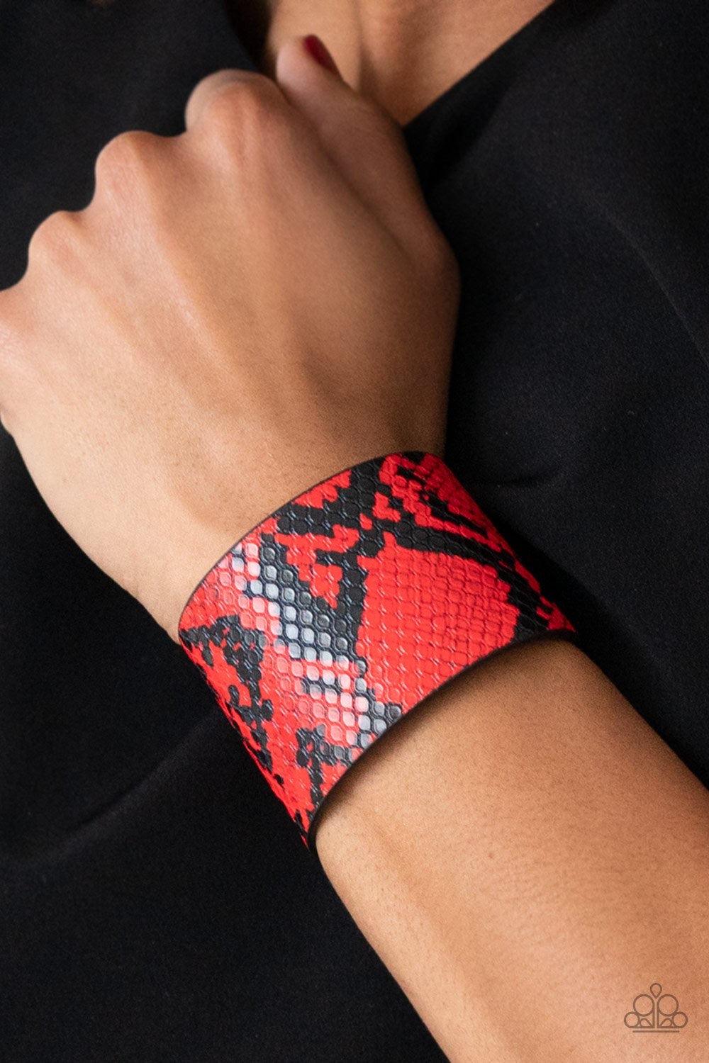 Paparazzi Accessories The Rest is HISS-Tory - Red Featuring a red python print, a thick black leather band wraps around the wrist for a wild look. Features an adjustable snap closure. Sold as one individual bracelet. Jewelry