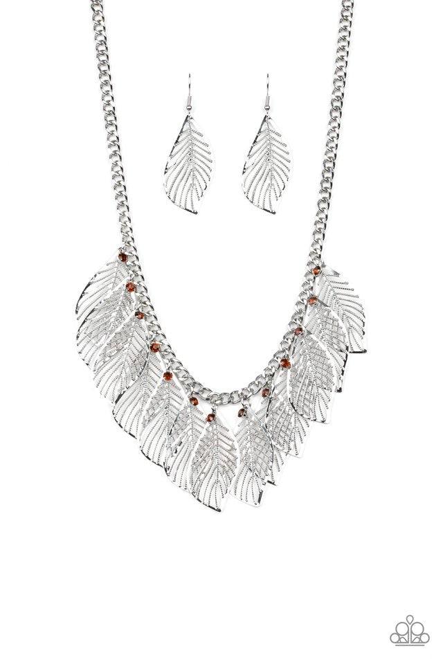 Paparazzi Accessories Feathery Foliage - Brown Dainty topaz rhinestones and leafy silver feathers swing from a thick silver chain, creating a whimsical fringe below the collar. Features an adjustable clasp closure. Jewelry