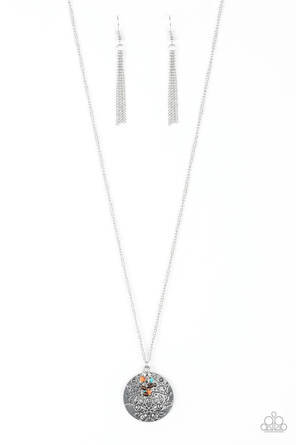 Paparazzi Accessories Desert Abundance - Multi A floral embossed silver disc and dainty wooden and multicolored stone beads swing from the bottom of a lengthened silver chain for whimsical look. Features an adjustable clasp closure. Sold as one individual