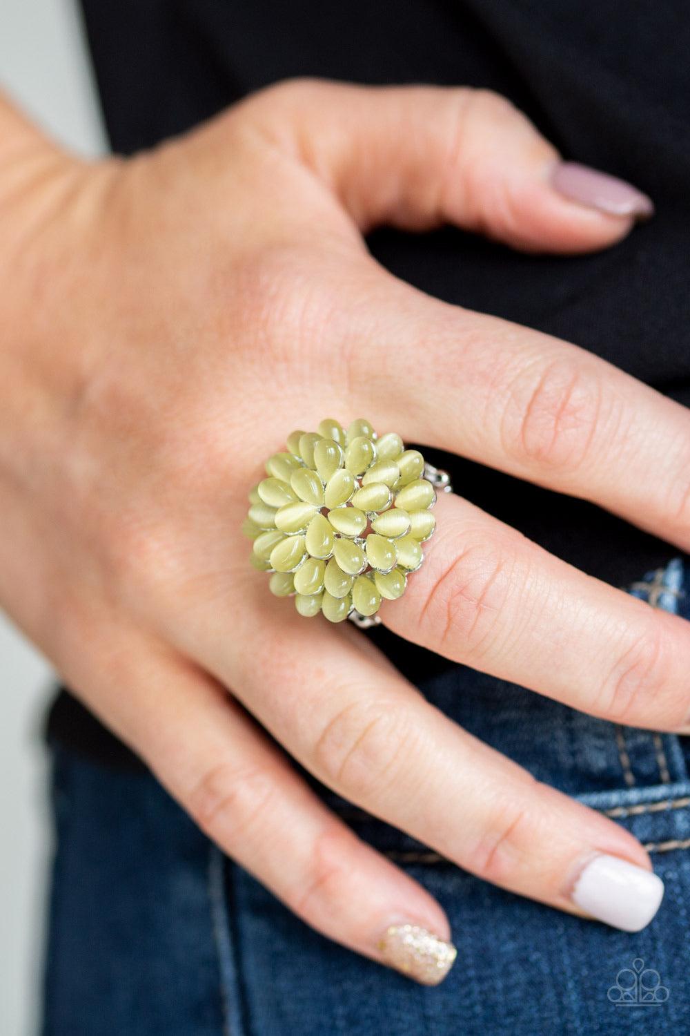 Paparazzi Accessories Bloomin Bloomer - Yellow Row after row of teardrop cat's eye stones stack into a blast of yellow petals atop the finger, creating a whimsical blossom. Features a stretchy band for a flexible fit. Jewelry