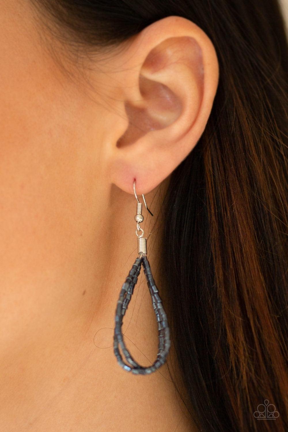 Paparazzi Accessories Catwalk Queen - Blue Strand after strand of metallic blue seed beads fall together to create a bold statement piece. Features an adjustable clasp closure. Jewelry