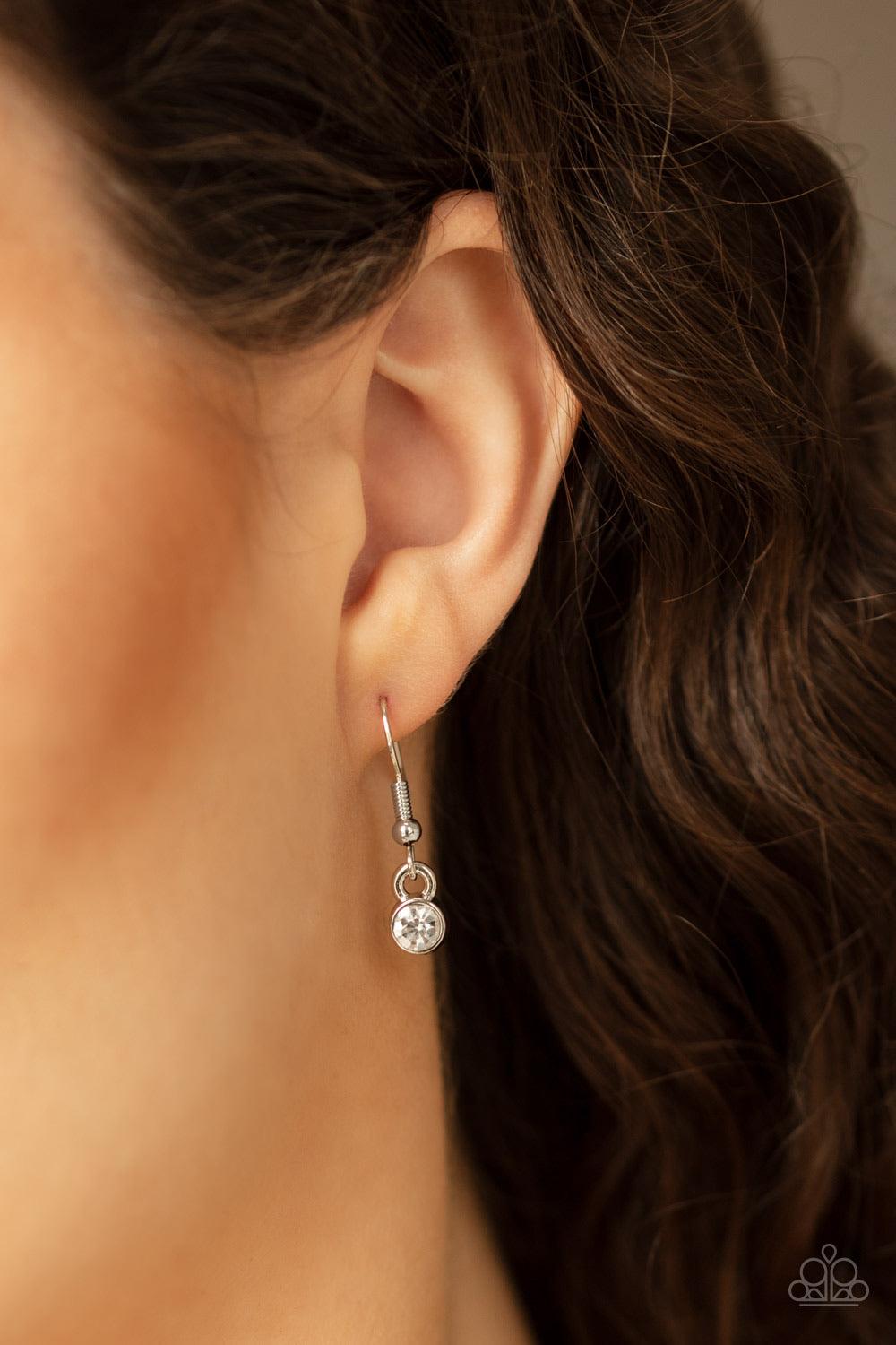 Paparazzi Accessories Infinite Impact - White Encrusted in sections of dainty white rhinestones, three interlinked silver infinity charms attach to a oversized silver chain below the collar for a bold industrial style. Features an adjustable clasp closure