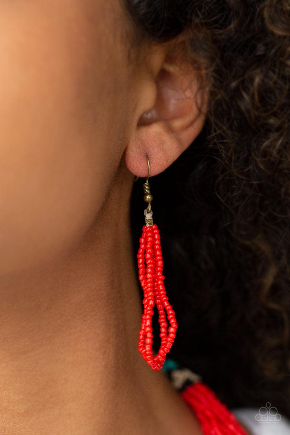 Paparazzi Accessories Rio Roamer - Red An assortment of black, brass, red, tan, and turquoise seed beads are threaded along invisible wires, creating colorful layers across the chest. Features an adjustable clasp closure. Jewelry