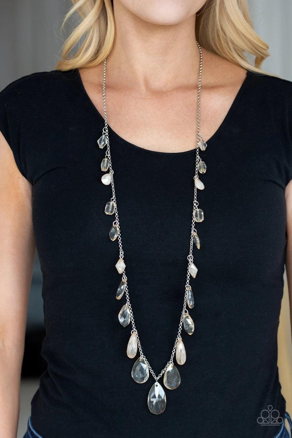 Paparazzi Accessories Glow And Steady Wins The Race - Brown A gorgeous collection of glassy and cloudy brown crystal-like beads trickle along a shimmery silver chain down the chest in a whimsical fashion. Features an adjustable clasp closure. Sold as one