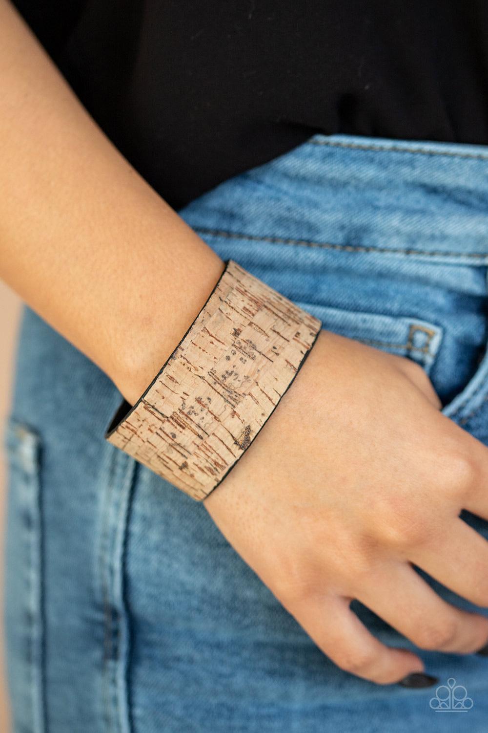 Paparazzi Accessories Cork Couture - Brown Featuring a cork-like finish, a thick cuff wraps around the wrist for a seasonal flair. Jewelry