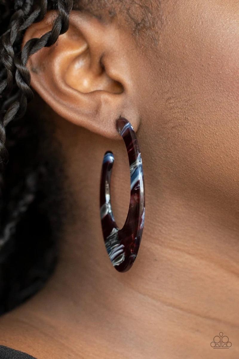 Paparazzi Accessories Retro Renaissance - Multi Lined in multicolored details, a shiny acrylic frame curves into an asymmetrical hoop for a colorfully retro look. Earring attaches to a standard post fitting. Hoop measures approximately 1 1/4" in diameter.