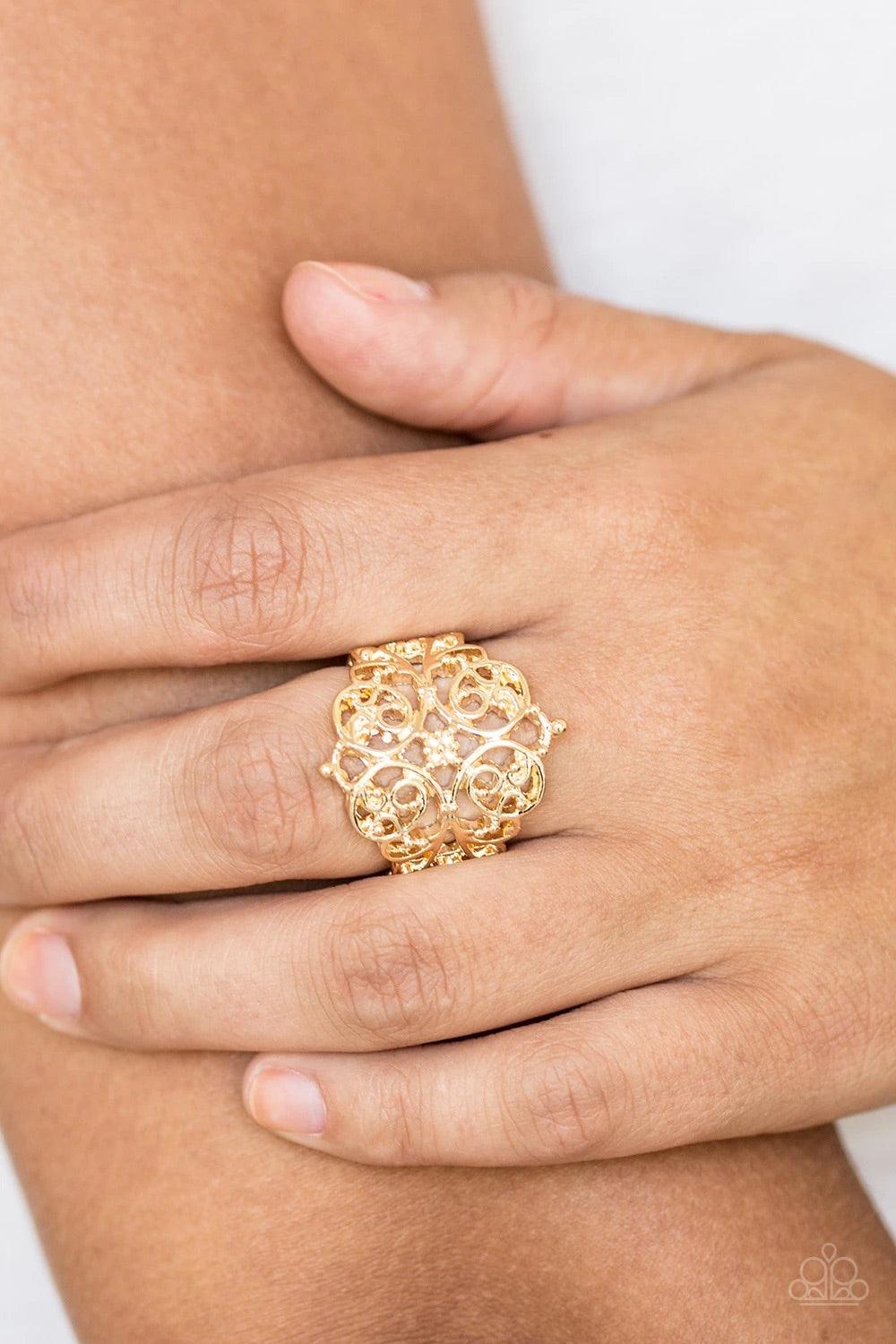Paparazzi Accessories Victorian Valor - Gold Brushed in a glistening finish, shimmery gold filigree vines curl across the finger, coalescing into an airy frame for a vintage-inspired look. Features a stretchy band for a flexible fit. Sold as one individua