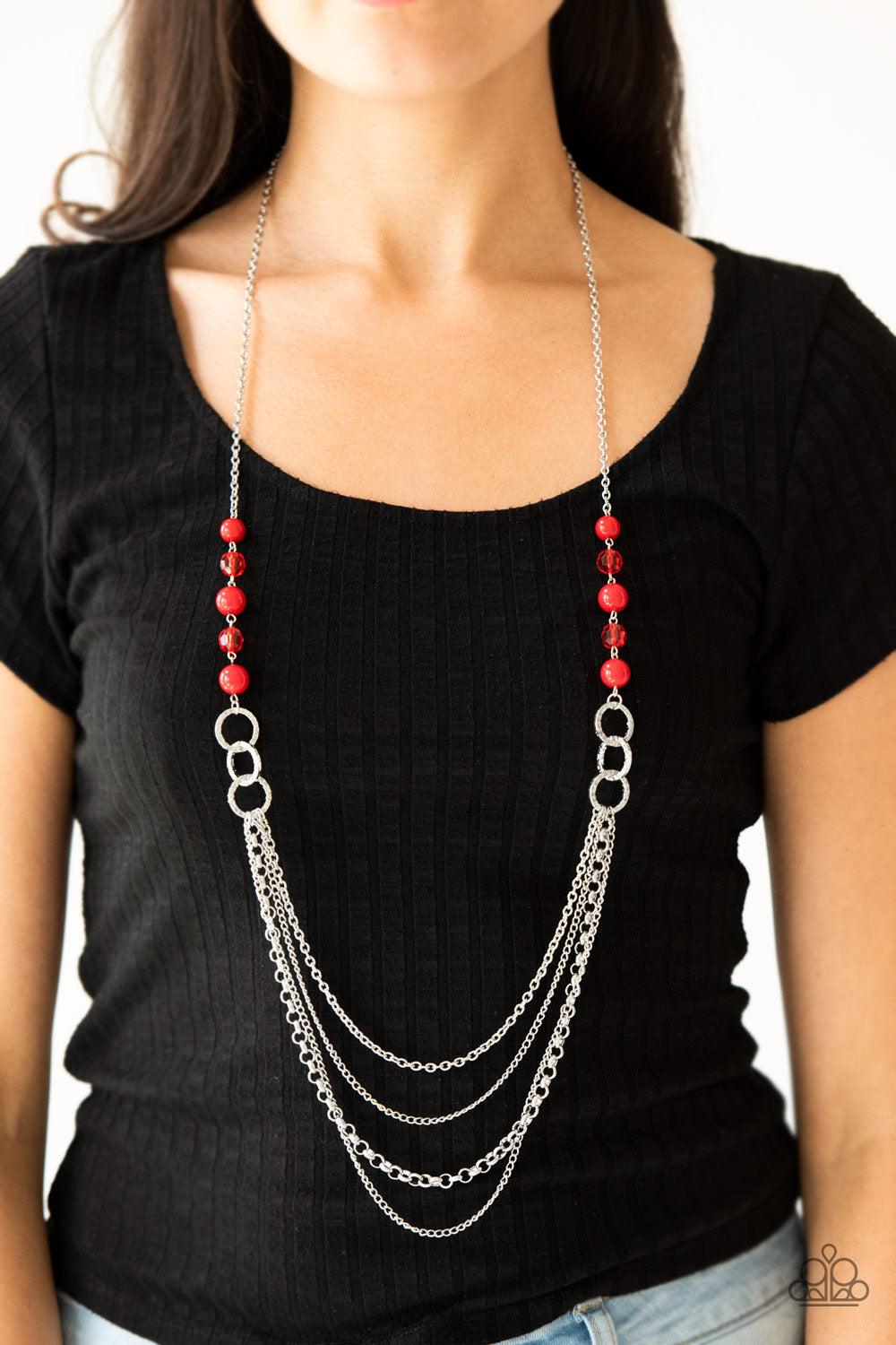 Paparazzi Accessories Vividly Vivid - Red Polished red, faceted crystal-like and delicately hammered silver hoops give way to mismatched silver chains down the chest for a whimsical look. Features an adjustable clasp closure. Sold as one individual neckla