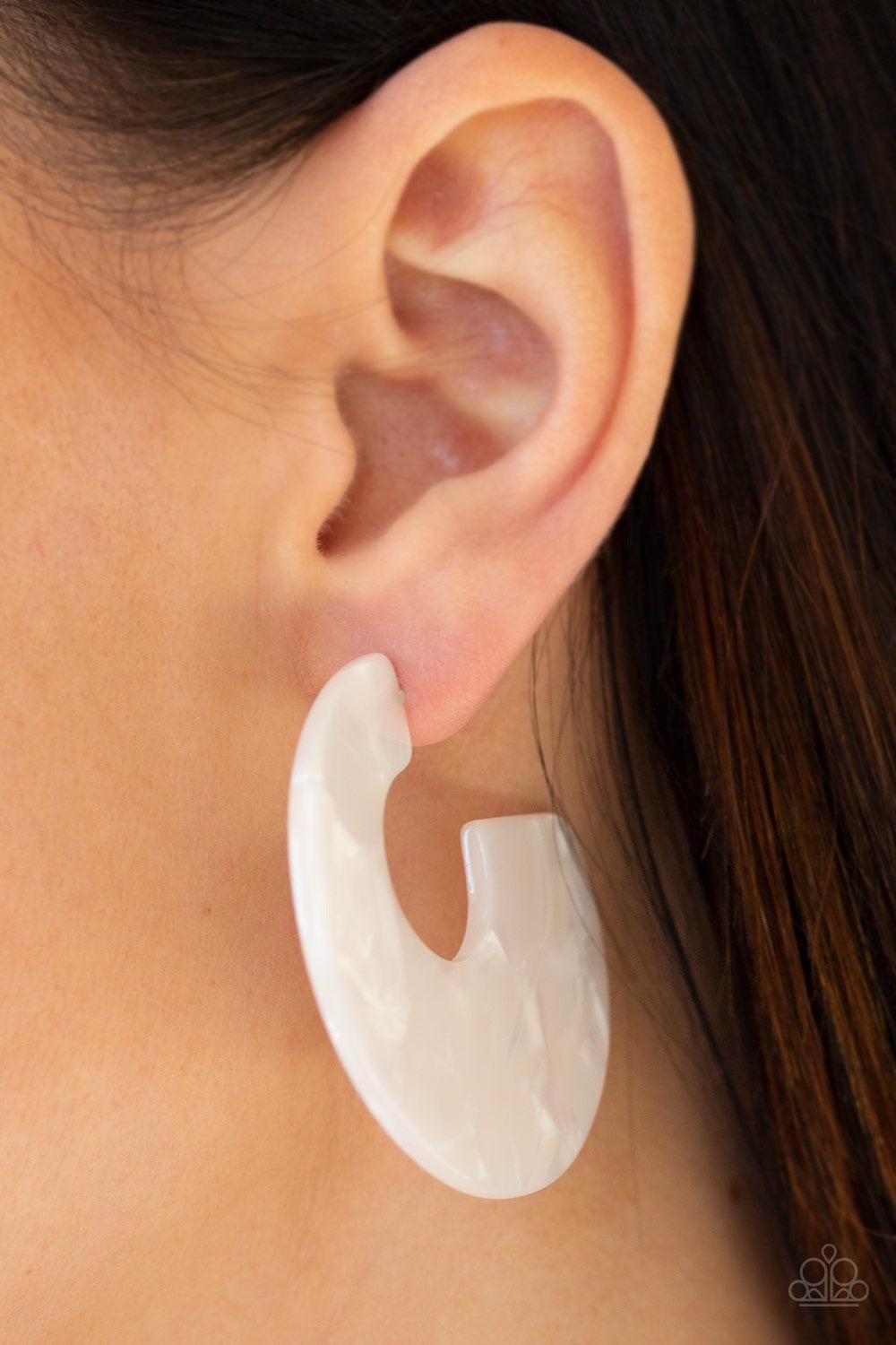 Paparazzi Accessories Tropically Torrid - White Brushed in an iridescent faux marble finish, a flat white hoop curls around the ear for a retro look. Earring attaches to a standard post fitting. Hoop measures 2" in diameter. Jewelry