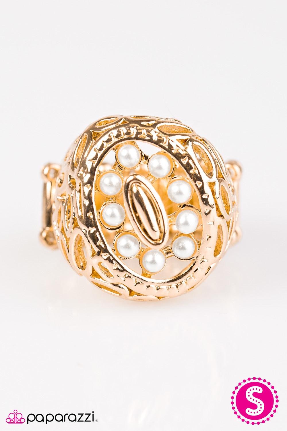 Paparazzi Accessories Full Tilt - Gold Glistening gold ovals climb the finger, stacking into an abstract frame. Dainty white pearls are pressed into the center of the frame, adding a neutral splash of color to the spunky asymmetrical palette. Jewelry