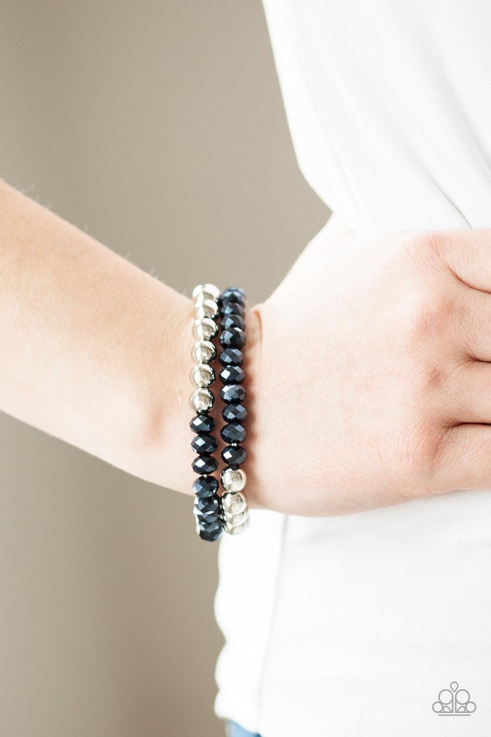Paparazzi Accessories Chroma Color - Blue Dipped in a metallic shimmer, a collection of glittery blue crystal-like beads and shiny silver beads are threaded along two stretchy bands around the wrist for a refined look. Jewelry