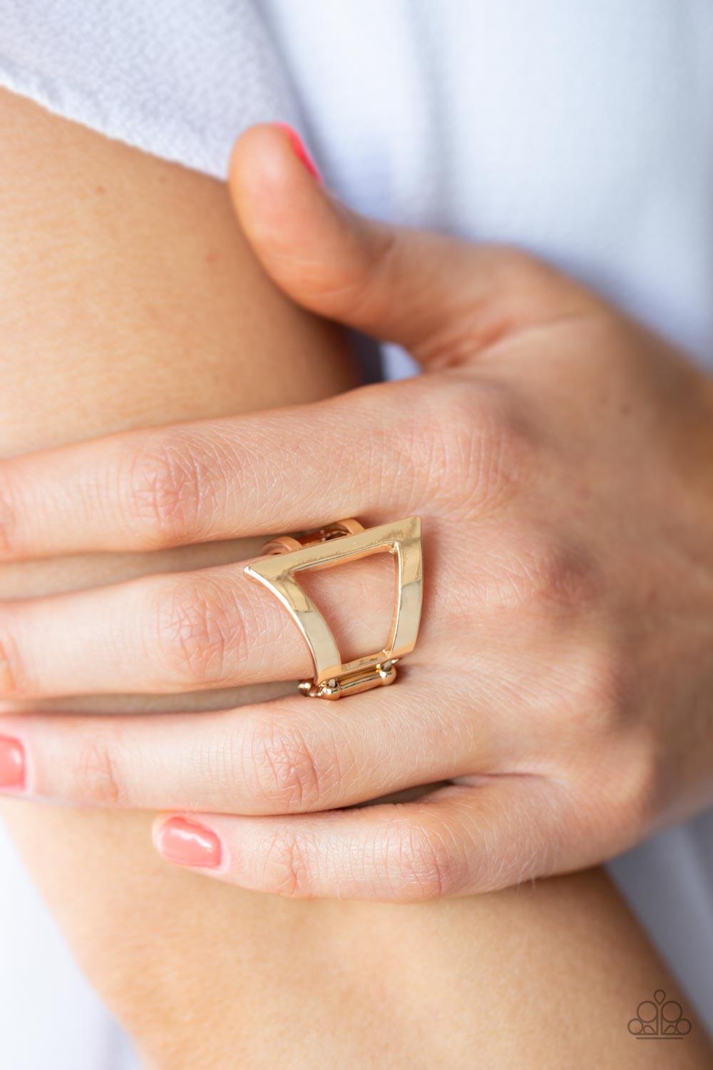 Paparazzi Accessories Rebel Edge - Gold Featuring a high sheen finish, flared gold bars create a bold asymmetrical triangle atop the finger. Two small gold bars wrap around the side for an edgy modern finish. Features a stretchy band for a flexible fit. S