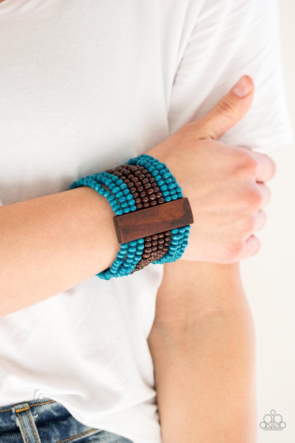 Paparazzi Accessories JAMAICAN Me Jam - Blue Infused with rectangular wooden beads, a collection of blue and brown wooden beads are threaded along stretchy bands for a summery flair. Jewelry