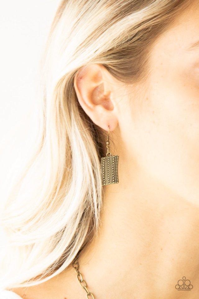 Paparazzi Accessories Fiercely Pharaoh - Brass Radiating in studded details, antiqued brass plates link below the collar, joining into a fierce geometric pendant. Features an adjustable clasp closure.Sold as one individual necklace. Includes one pair of m