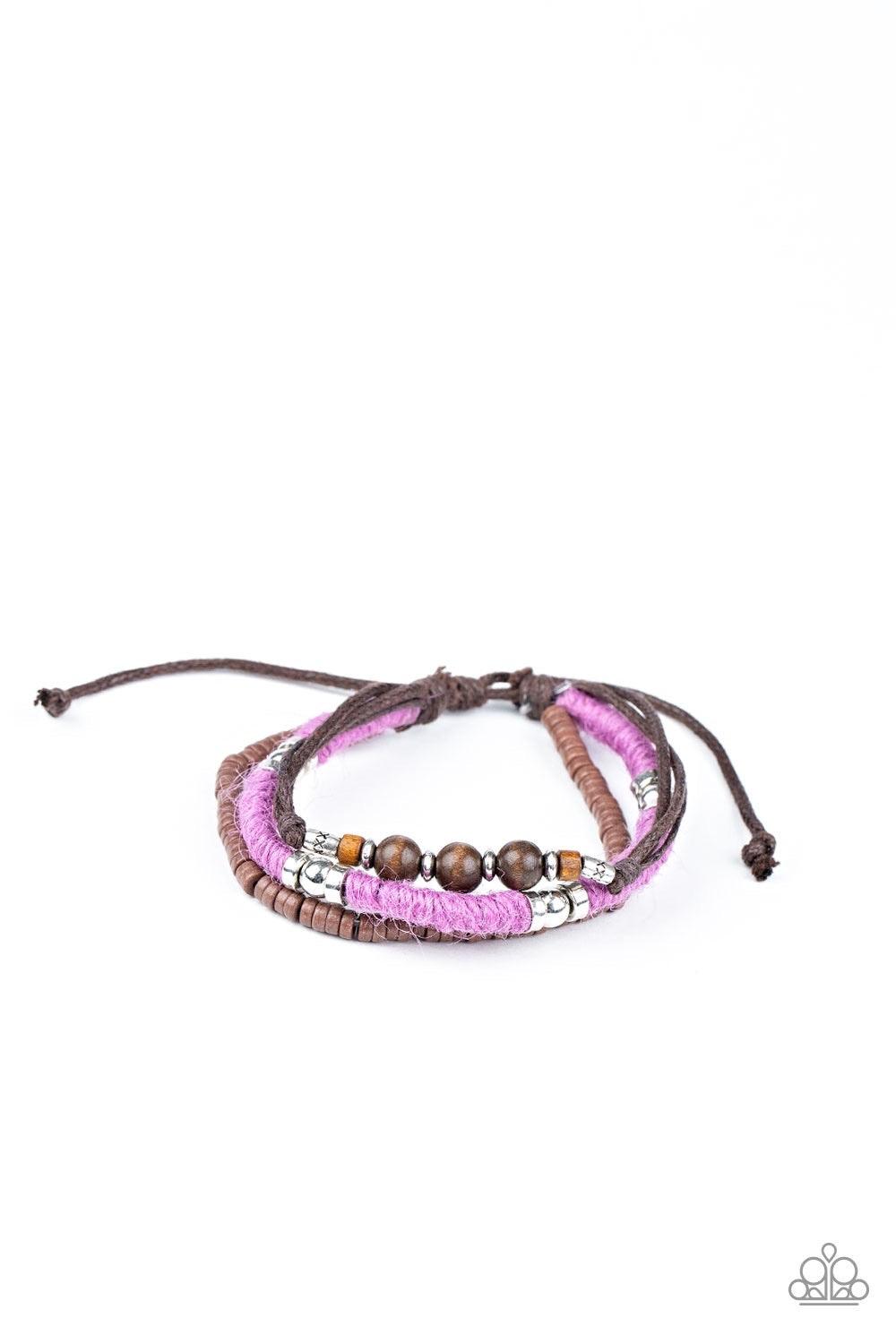 Paparazzi Accessories Totally Tiki - Purple Infused with wooden and silver accents, mismatched strands of purple twine and brown cording layer around the wrist for a colorfully seasonal look. Features an adjustable sliding knot closure. Sold as one indivi
