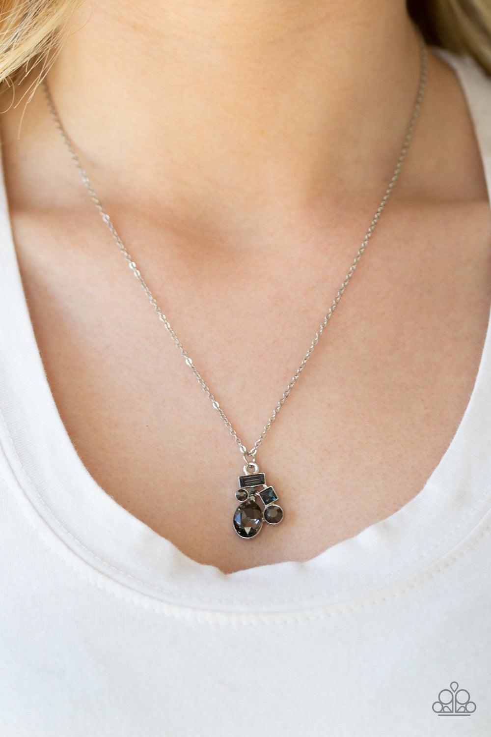 Paparazzi Accessories Time To Be Timeless - Silver Varying in shape and size, smoky and hematite rhinestones coalesce into a sparkling pendant below the collar for a timeless look. Features an adjustable clasp closure. Jewelry