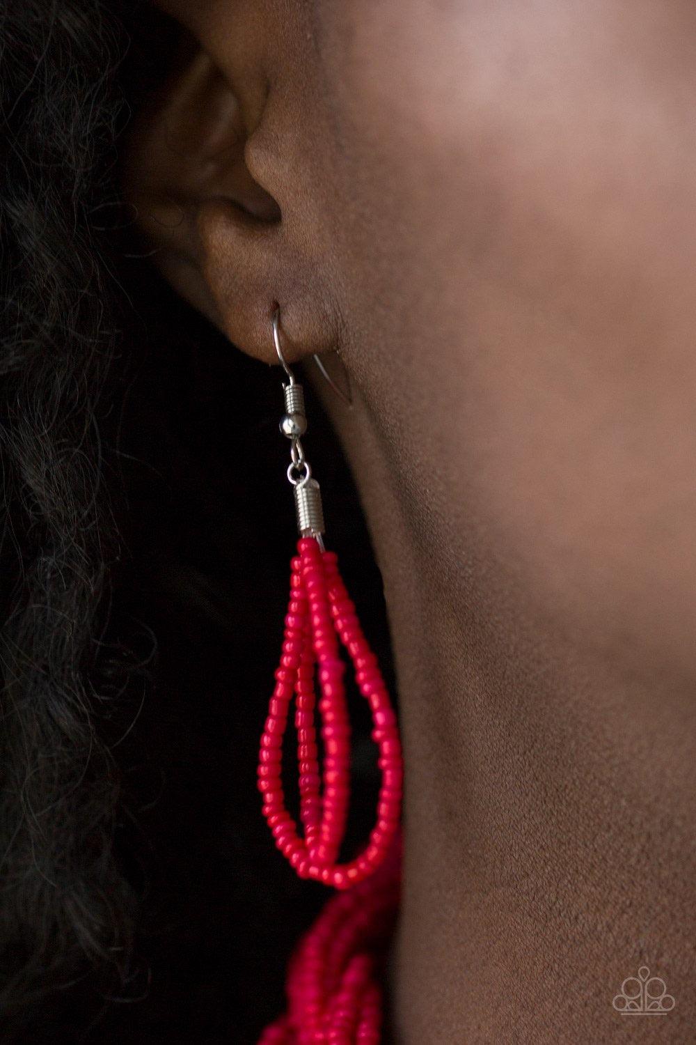 Paparazzi Accessories Brazilian Brilliance - Red Strands of red seed beads create an indigenous braid below the collar. The red seed beads gradually morph into metallic silver beads at the center for a chic contrasting look. Features an adjustable clasp c