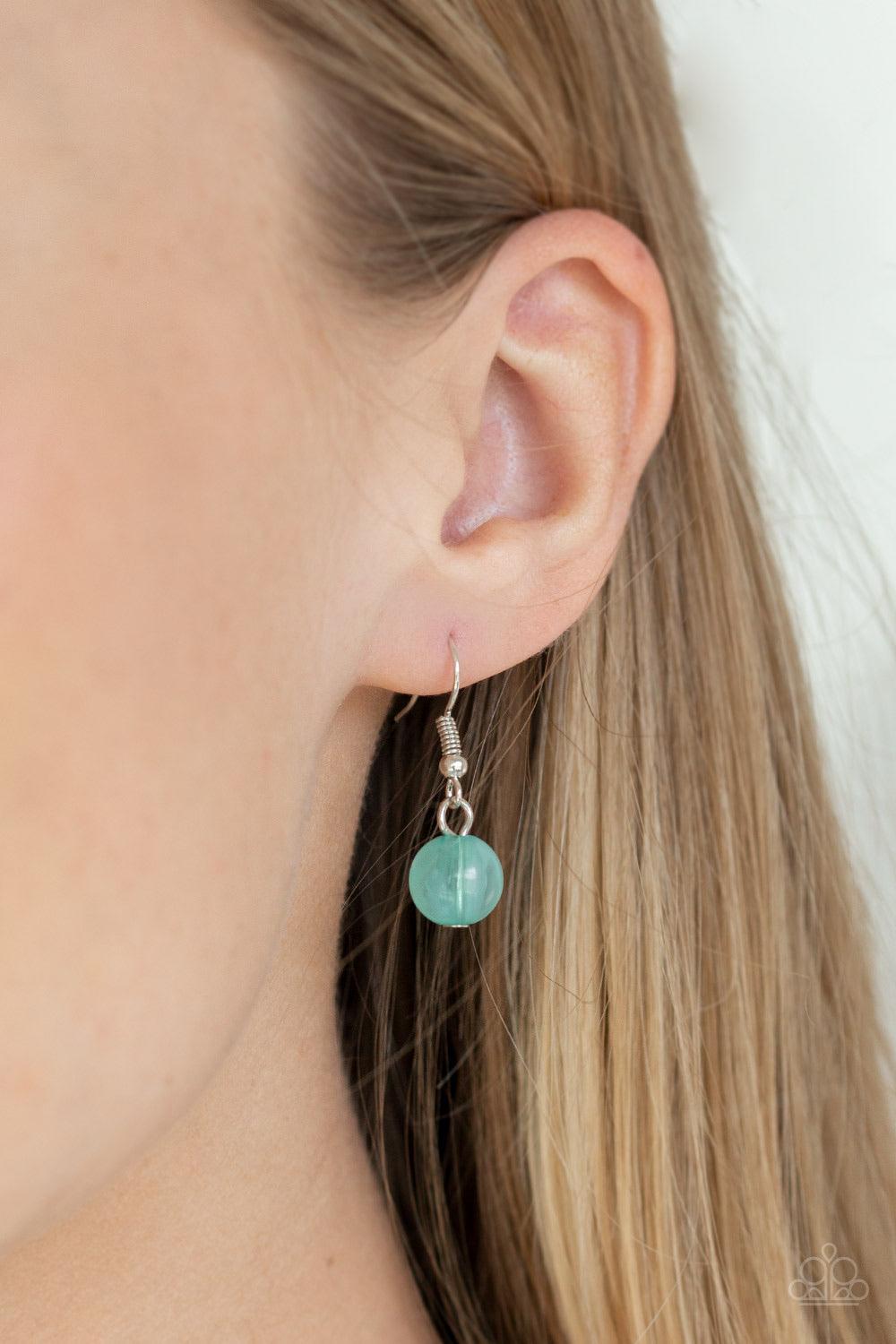 Paparazzi Accessories Trending Tropicana ~Green A row of cloudy green beads gives way to a row of shiny silver beads. Brushed in an opalescent finish, green teardrops cascade from the bottom of bold interlocking silver chains, creating a dramatically colo