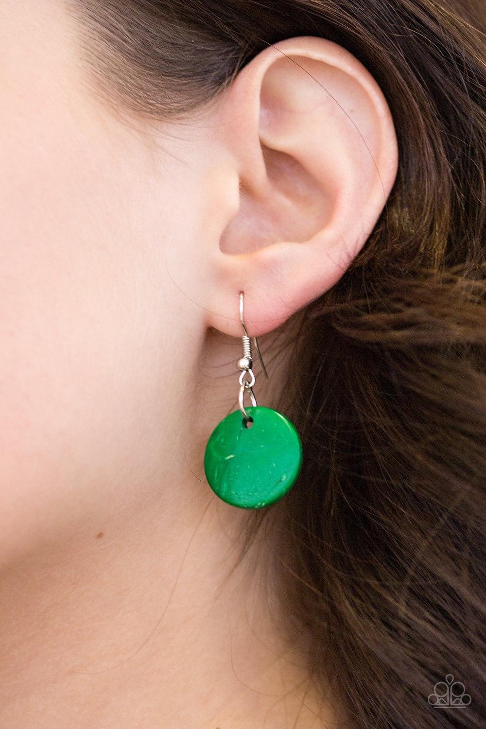 Paparazzi Accessories Bali Boardwalk - Green Brushed in a distressed finish, refreshing green wooden beads and discs trickle along three strands, creating a summery look down the chest. Features a button loop closure. Necklaces