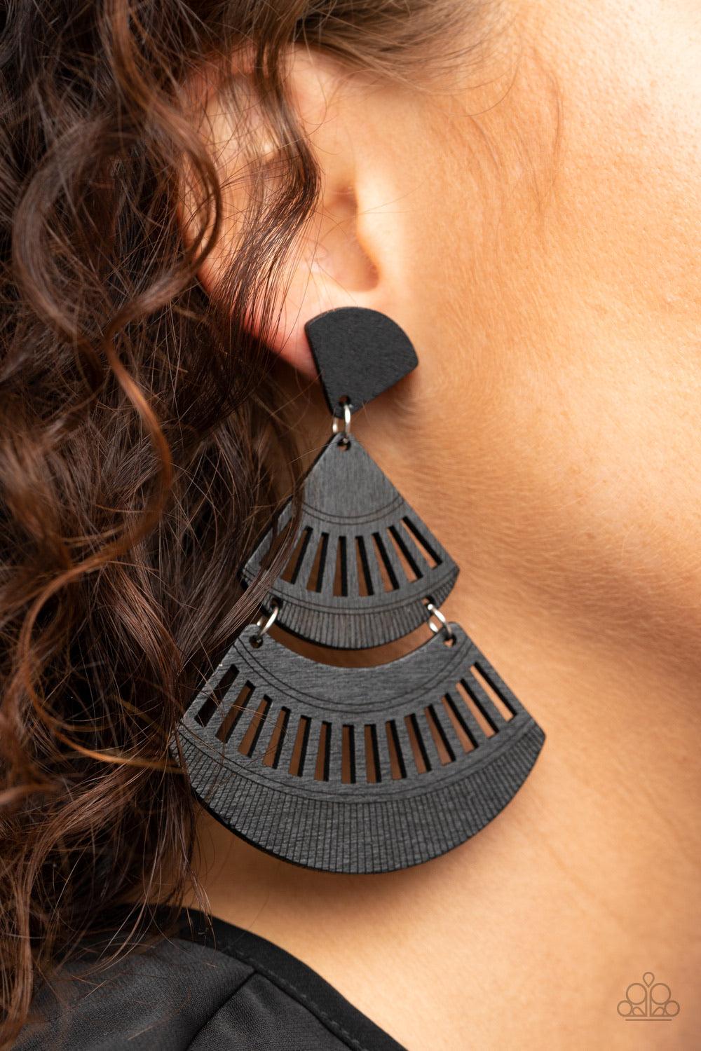 Paparazzi Accessories Oriental Oasis - Black Stenciled in airy cutout details, an earthy collection of triangular and crescent-shaped black wooden frames delicately connect into a fanned out lure. Earring attaches to a standard post fitting. Sold as one p