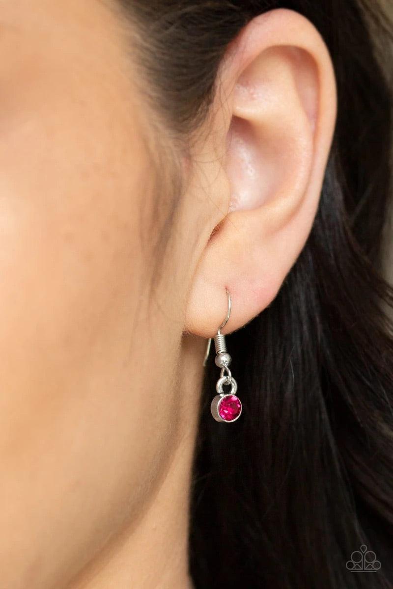 Paparazzi Accessories Money Mood - Pink Ringed in a studded silver frame, glittery pink and hematite rhinestones collect into a glamorous pendant at the bottom of a lengthened silver chain for a refined flair. Features an adjustable clasp closure. Sold as