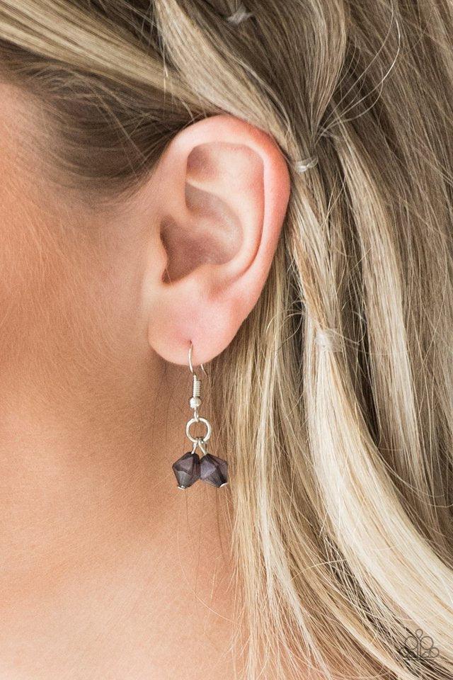 Paparazzi Accessories Grand Canyon Grotto - Black Featuring polished and cloudy finishes, a collection of black faux rocks dance from the bottom of a bold silver chain. Classic silver beads trickle between the colorful beading, adding a metallic shimmer t