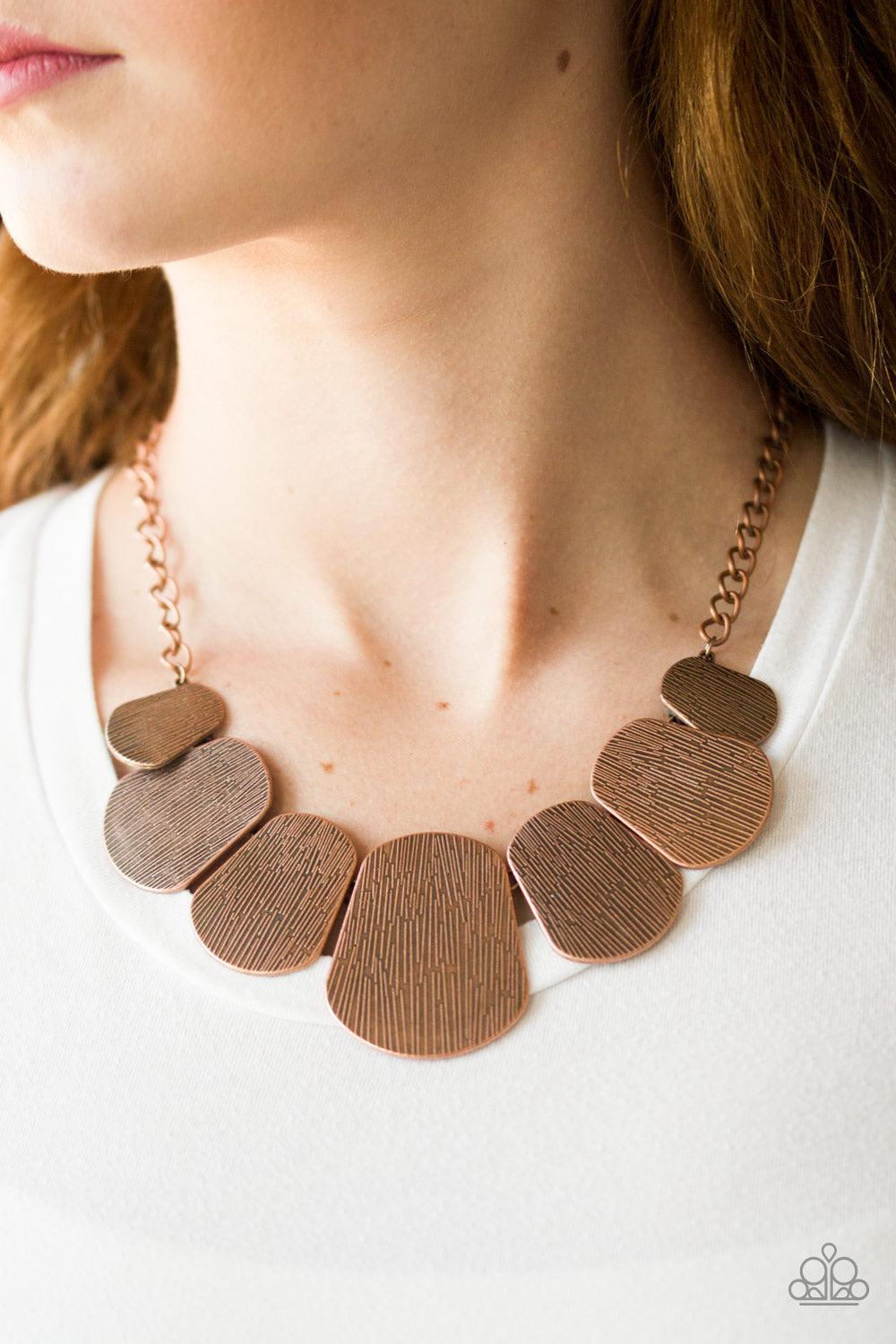 Paparazzi Accessories CAVE The Day - Copper Embossed in glistening linear textures, shimmery copper plates connect below the collar, creating a fierce fringe. Features an adjustable clasp closure. Sold as one individual necklace. Includes one pair of matc