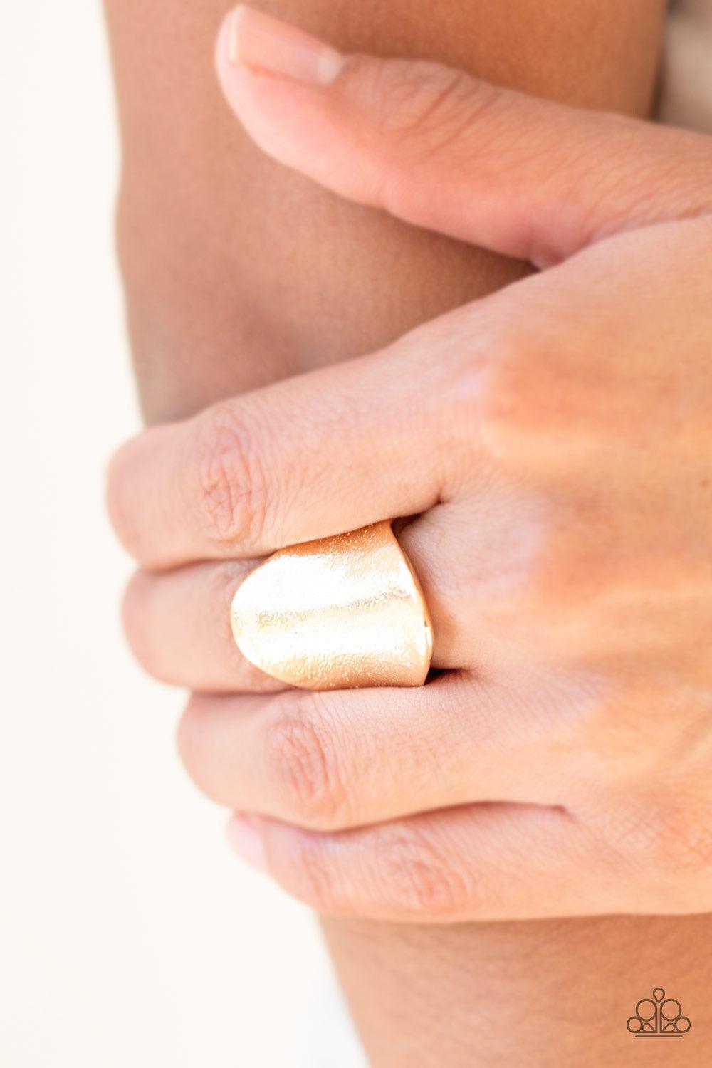 Paparazzi Accessories Metro Mirror - Gold Delicately hammered in shimmery textures, a glistening gold frame curls around the finger for an edgy look. Features a stretchy band for a flexible fit. Jewelry