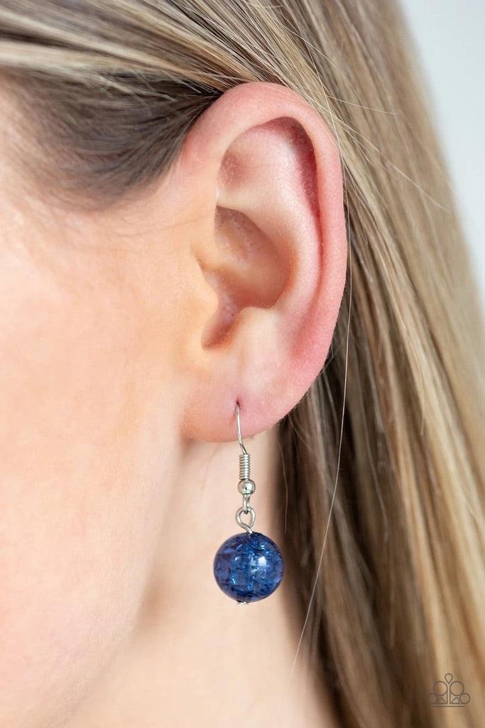 Paparazzi Accessories Shimmer Simmer - Blue A collection of faceted, crystal-like, and sparkling blue beads join across the chest. Hammered silver rings are sprinkled between the colorful accents for a whimsical finish. Features an adjustable clasp closur