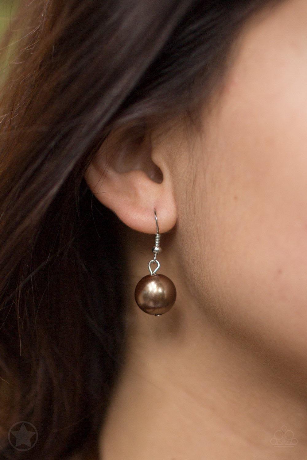 Paparazzi Accessories All The Trimmings - Brown A silky brown ribbon replaces a traditional chain to give an elegant look. Pearly brown beads and funky silver pieces intermix with varying lengths of silver chains to give a fresh take on a Victorian-inspir