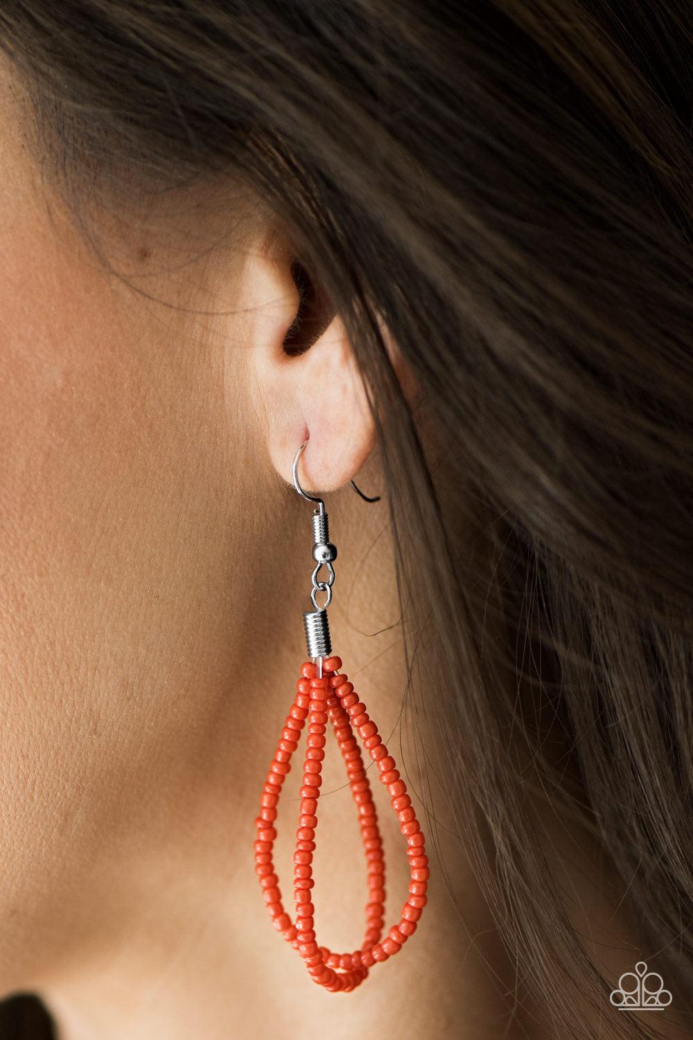 Paparazzi Accessories Brazilian Brilliance - Orange Strands of orange seed beads create an indigenous braid below the collar. The orange seed beads gradually morph into metallic silver beads at the center for a chic contrasting look. Features an adjustabl
