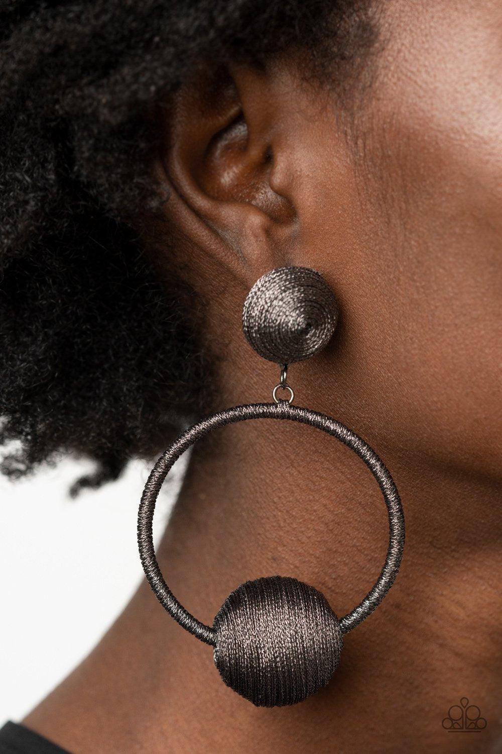 Paparazzi Accessories Social Sphere - Black Shimmery gunmetal thread wraps around an oversized bead that is fitted in place along the bottom of a matching threaded hoop. The glistening display links to the bottom of a matching gunmetal threaded fitting, c