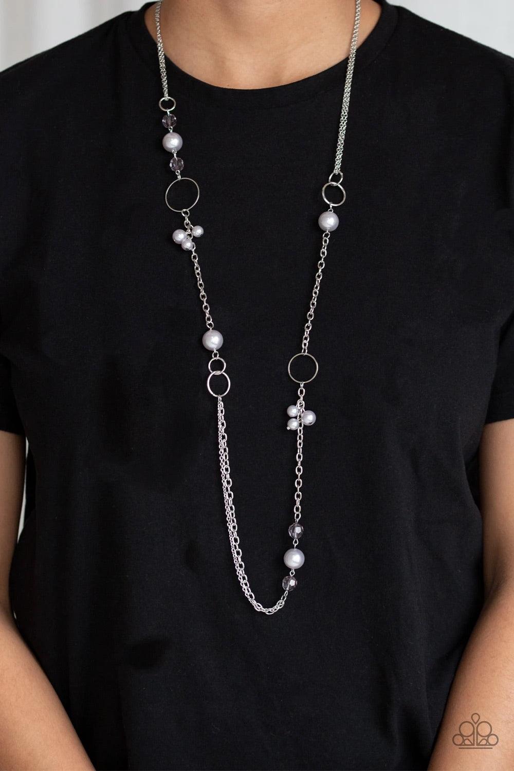 Paparazzi Accessories Pageant Princess - Silver A collection of glistening silver hoops, smoky beads, and pearly silver beads trickle along a shimmery silver chain for a refined look. Features an adjustable clasp closure. Sold as one individual necklace.