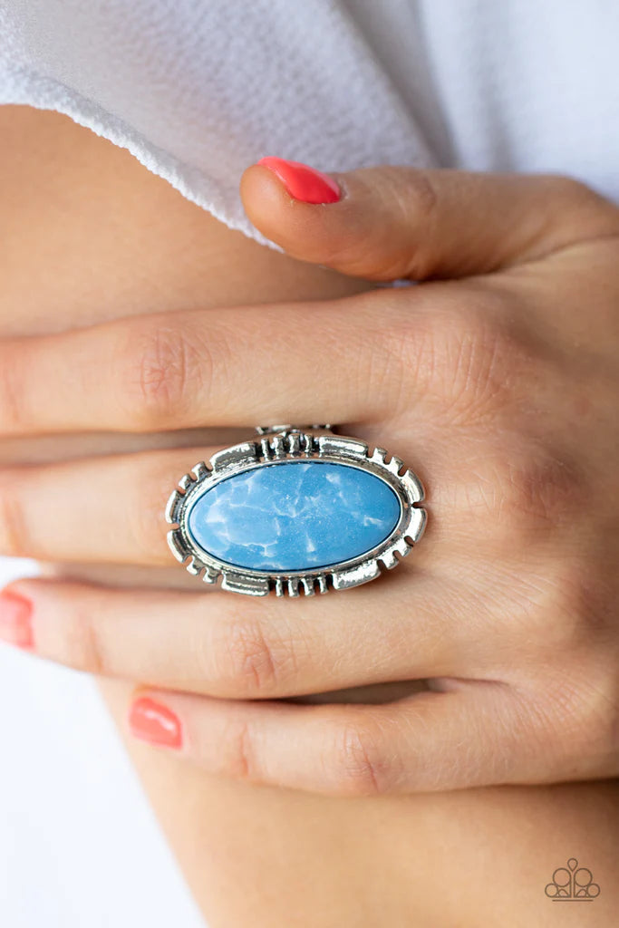 Paparazzi Accessories Peacefully Pioneer - Blue A refreshing blue oval stone is pressed into the center of a textured silver frame, creating an abstract artisanal display atop the finger. Features a stretchy band for a flexible fit. Sold as one individual
