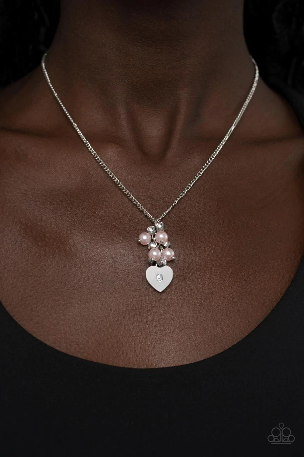 Paparazzi Accessories Pop It and LOCKET - Pink Dotted with a dainty white rhinestone, a shiny silver heart swings from the bottom of a bubbly cluster of pink pearls and white rhinestones, creating a locket inspired pendant below the collar. Features an ad