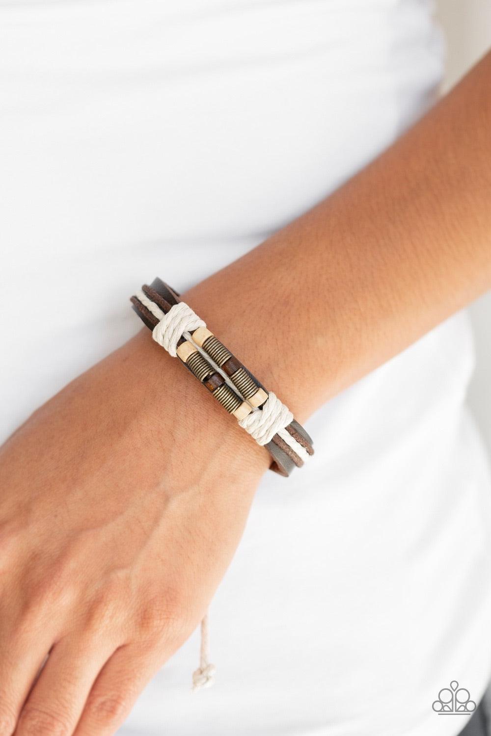 Paparazzi Accessories Wonderfully Woodsy - Brown White twine knots wooden and brass beads along the front of a brown leather band, creating a seasonal centerpiece. Features an adjustable sliding knot closure. Jewelry