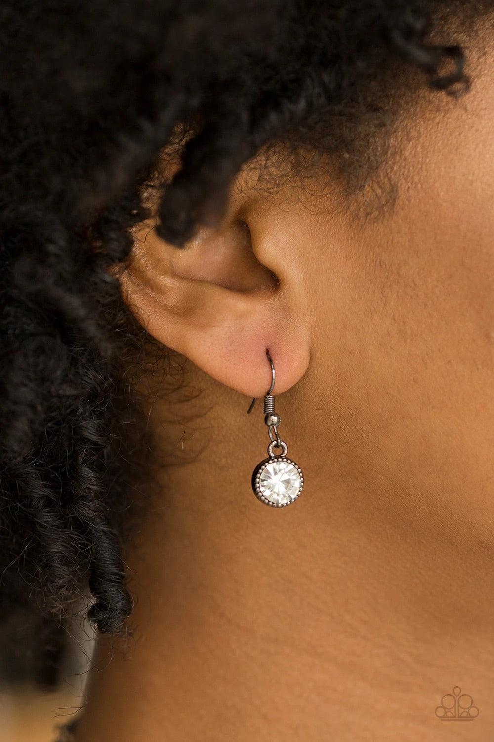 Paparazzi Accessories Starlit Socials - Black Encased in studded gunmetal frames, glittery white rhinestones link below the collar for a glamorous look. Features an adjustable clasp closure. Sold as one individual necklace. Includes one pair of matching e