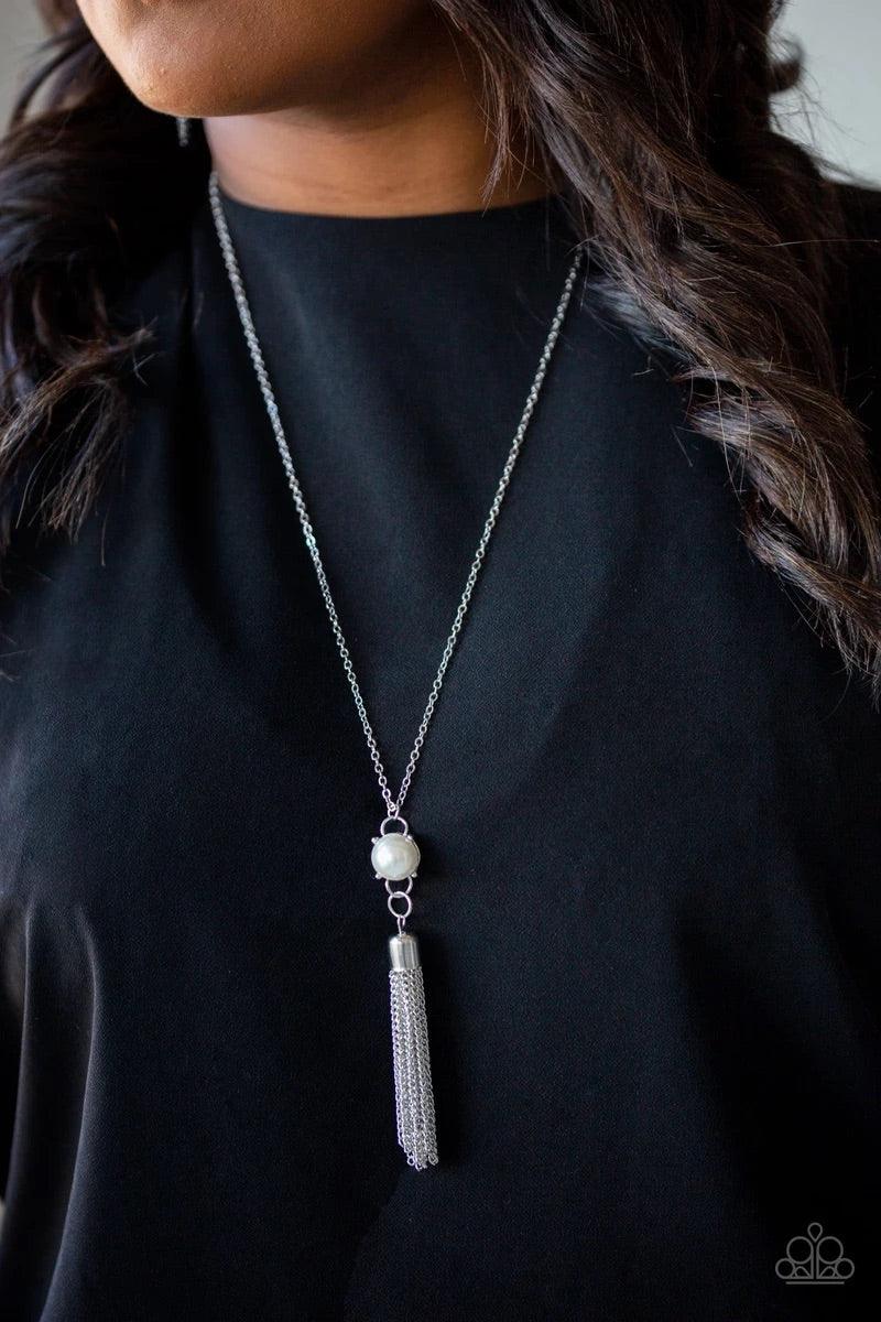 Paparazzi Accessories Diva Dance Party - White A pearl dotted frame gives way to a shimmery silver chain tassel, creating a timelessly stacked pendant at the bottom of a lengthened silver chain. Features an adjustable clasp closure. Sold as one individual