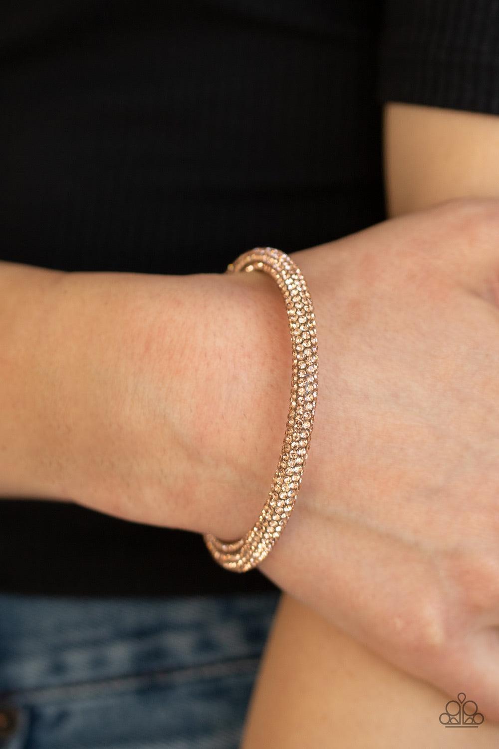 Paparazzi Accessories Stageworthy Sparkle - Gold Bedazzled in sparkling rhinestones, a bendable cuff-like bracelet delicately curls around the wrist for a refined look. Jewelry